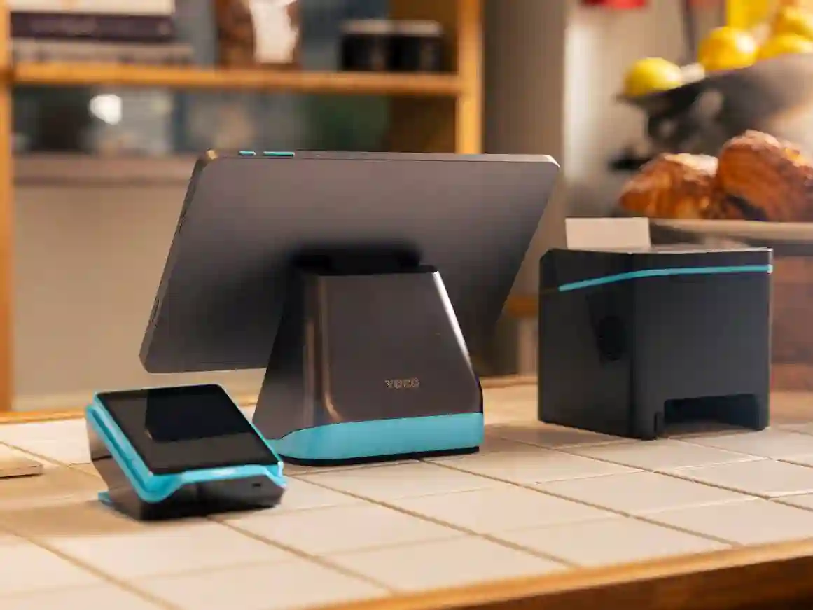 Yoco Counter POS setup with Yoco card machine and receipt printer on a café counter.