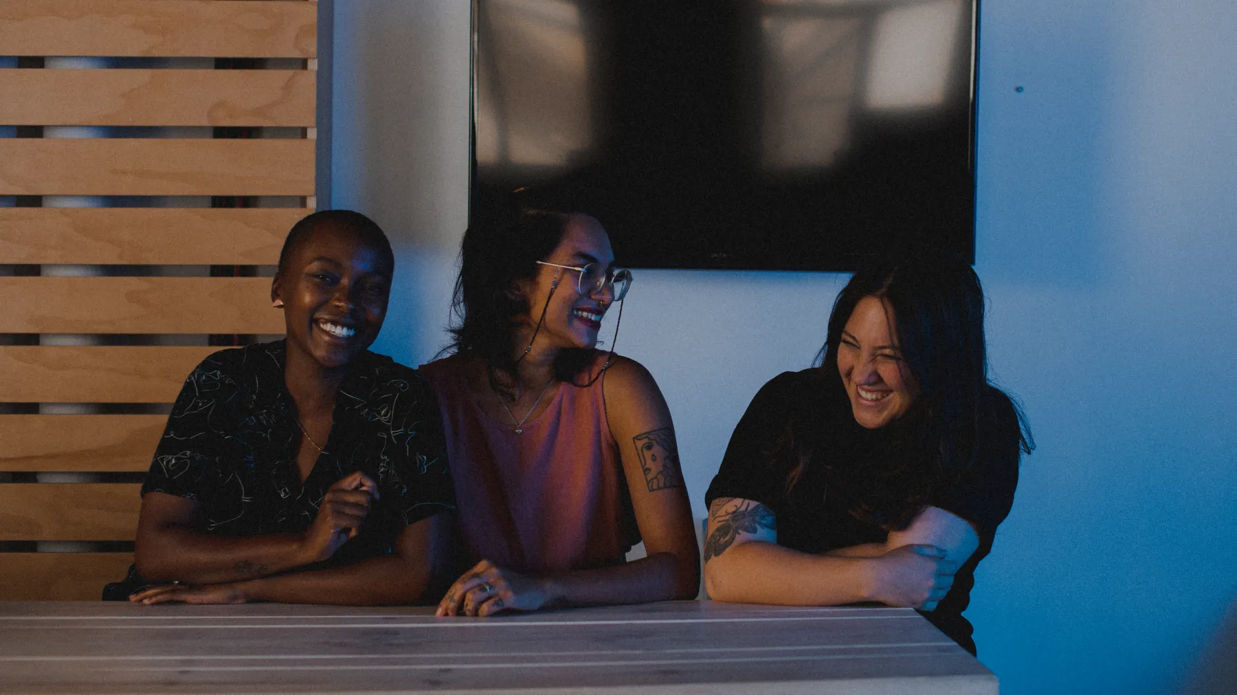 A happy, engaged team enjoying a moment together—showcasing the power of hiring more staff to strengthen and grow your business.