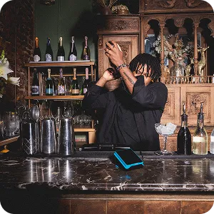 Collage showing Yoco POS systems in use across cafés and retail stores, including tablets, card machines, and payment screens.