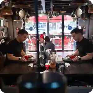 Collage showing Yoco POS systems in use across cafés and retail stores, including tablets, card machines, and payment screens.