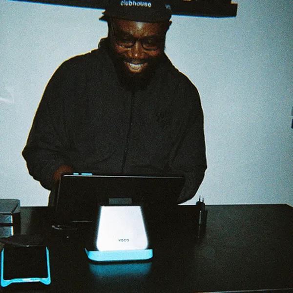 Yoco merchant using the Yoco Counter POS system at a coffee shop.