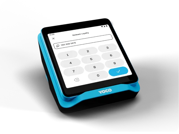Customer enters their cell number on a Yoco card machine to access and redeem loyalty points.